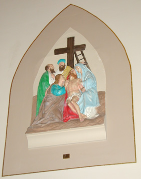 XIII: Jesus is laid in His mother's arms.